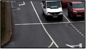 Entry LPR camera view of a van and a red SUV crossing the intersection stop line