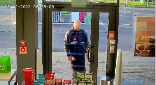 Good camera placement example: a man entering a store faces the entrance camera directly at close range with a clear frontal view of his face