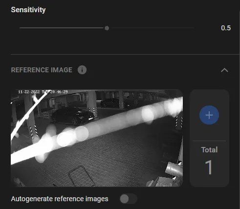 TamperTrack Sensitivity slider set to 0.5 with a reference image panel showing a glare-affected parking garage scene and the Autogenerate reference images toggle