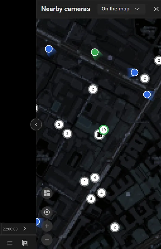 Nearby cameras panel open to the right of the player, On the map view, with camera markers and a building icon on the street map